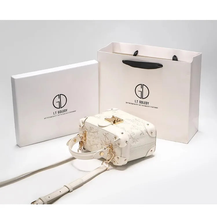 Mostra borsa elegante 2025 con motivo floreale in rilievo ideale per le feste serali da donna, anche una pratica tracolla per l'uso quotidiano