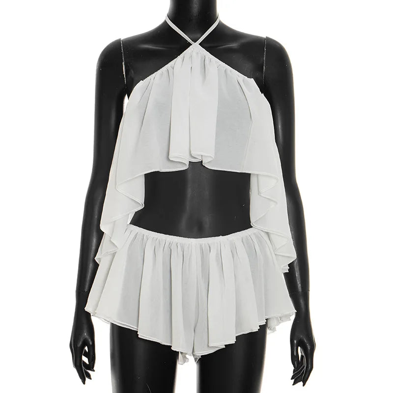 Completo due pezzi Chaxiaoa da donna, estivo 2026, sexy, con top halter senza schienale e minigonna pantaloncino, per feste e serate in discoteca